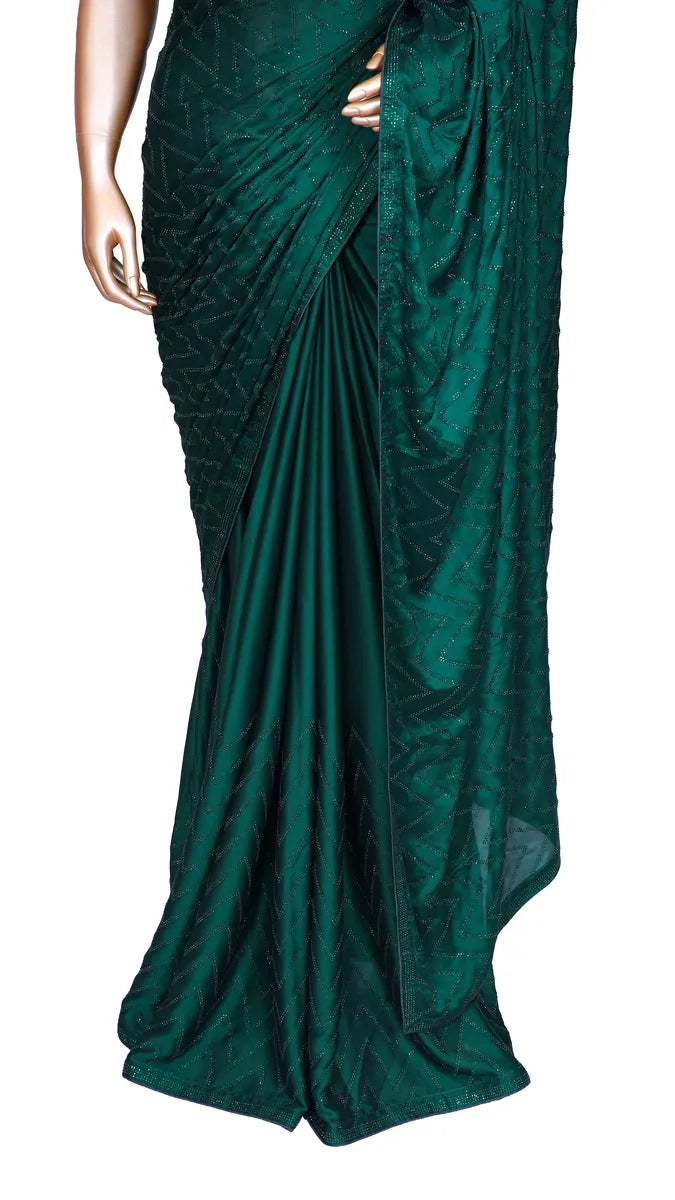 Bottle green satin saree with machine-pressed Swarovski crystal work