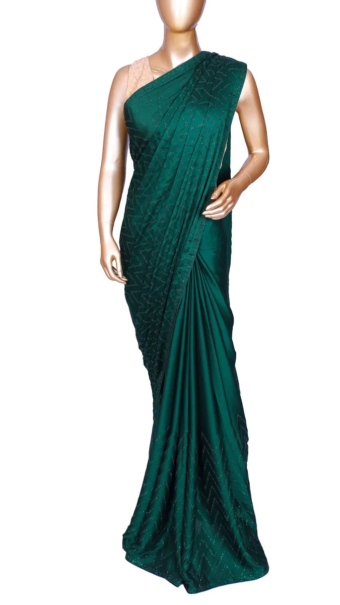 Bottle green satin saree with machine-pressed Swarovski crystal work
