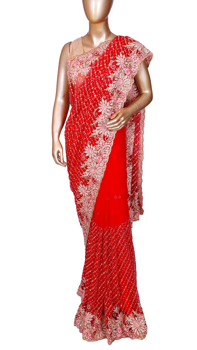 Red soft net saree with fancy embroidery and mirror work