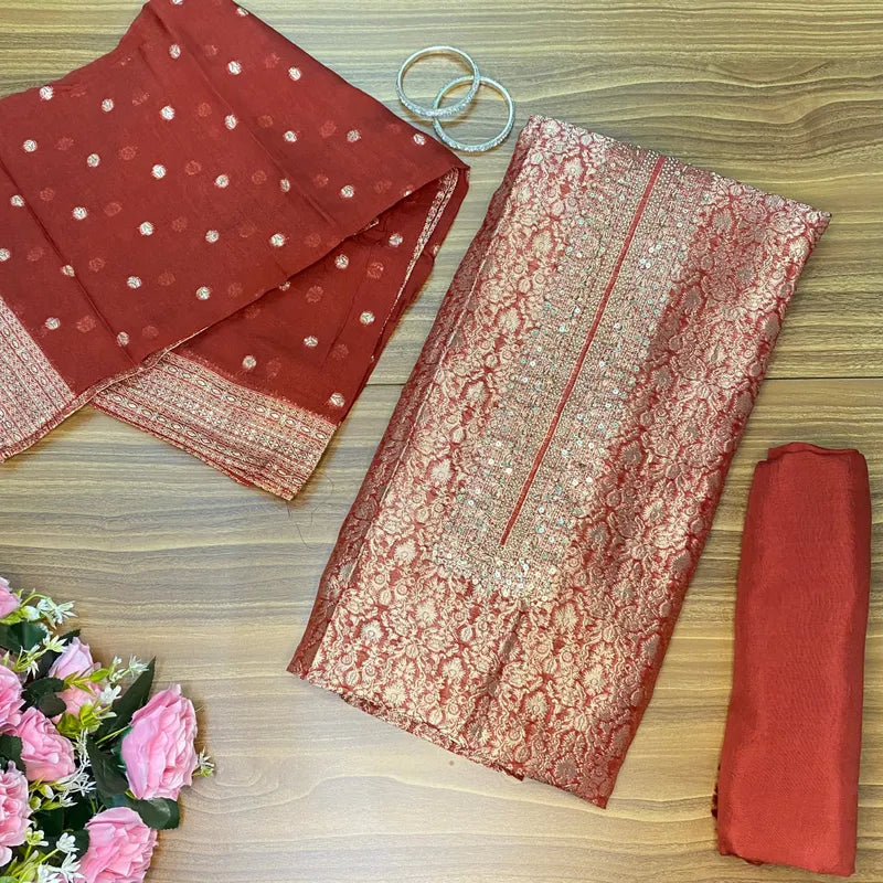 Rust colour Banarasi brocade unstitched suit with subtle handwork on neckline