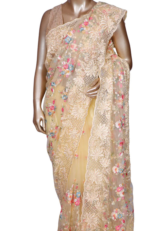 Lemon yellow net saree with multi threadwork and crystal highlights