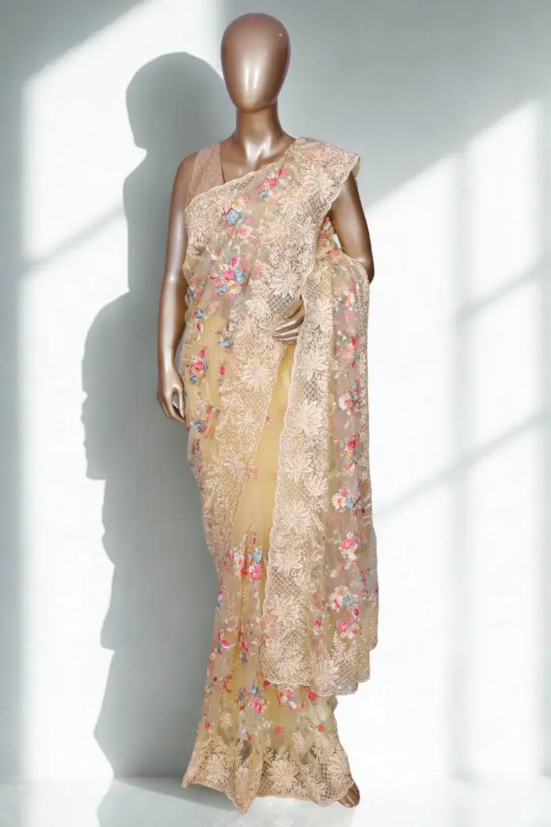 Lemon yellow net saree with multi threadwork and crystal highlights
