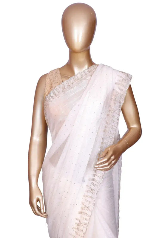 Off-White soft metallic organza saree with machine-pressed Swarovski crystal work border