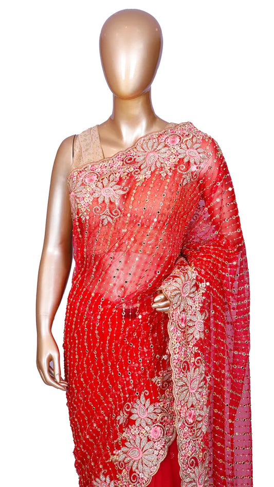 Red soft net saree with fancy embroidery and mirror work
