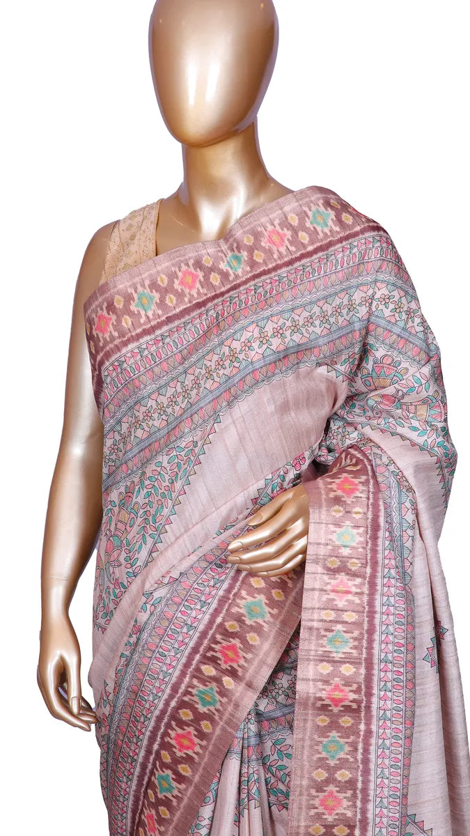Beige tussar blend saree with Kalamkari prints and Patola border