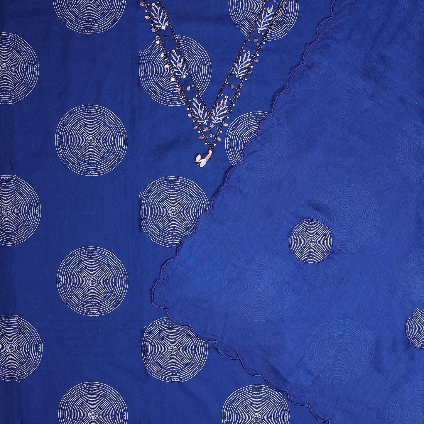 Deep blue cotton unstitched suit with all-over print and light beads work on V-neckline