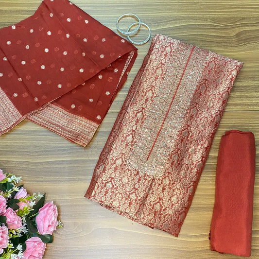 Rust colour Banarasi brocade unstitched suit with subtle handwork on neckline