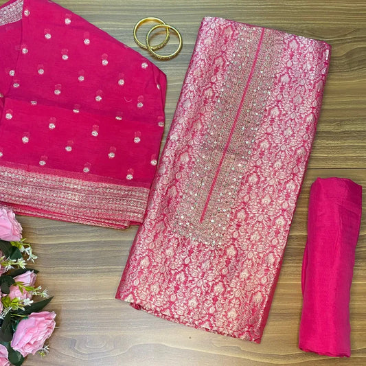 Rani colour Banarasi brocade unstitched suit with subtle handwork on neckline