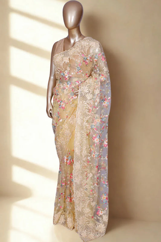 Lemon yellow net saree with multi threadwork and crystal highlights